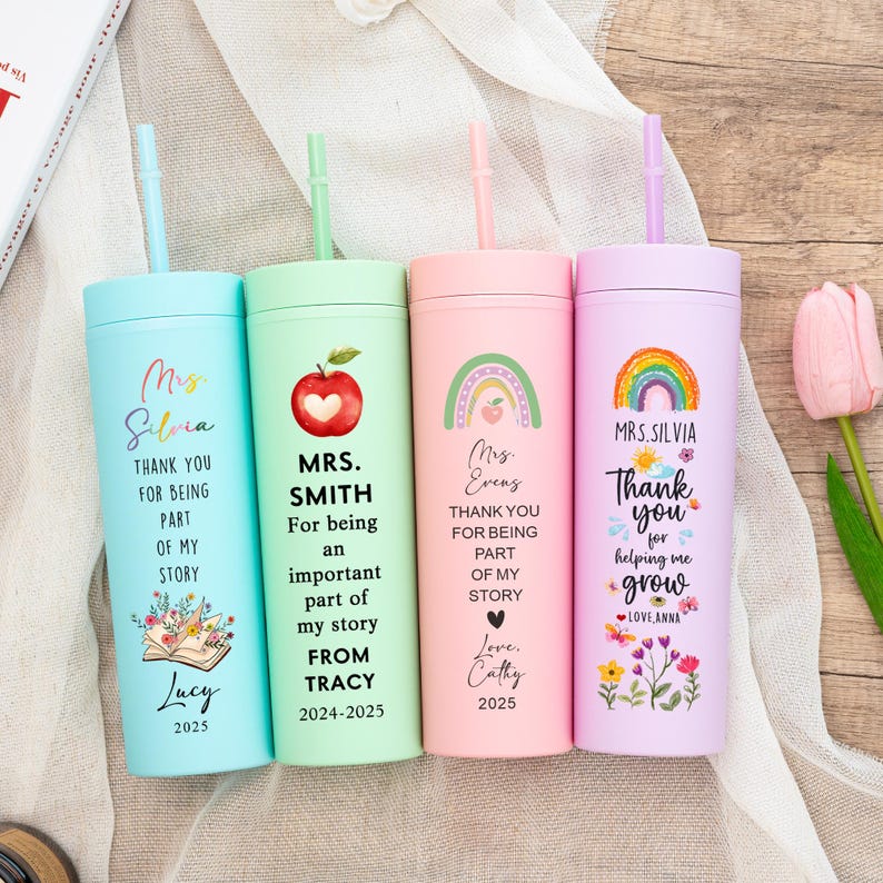 May include: Four colorful tumblers with straws, each featuring a different design and text. The tumblers are light blue, green, pink, and purple. The text includes names, messages of gratitude, and the years 2024-2025. The tumblers are a teacher appreciation gift.