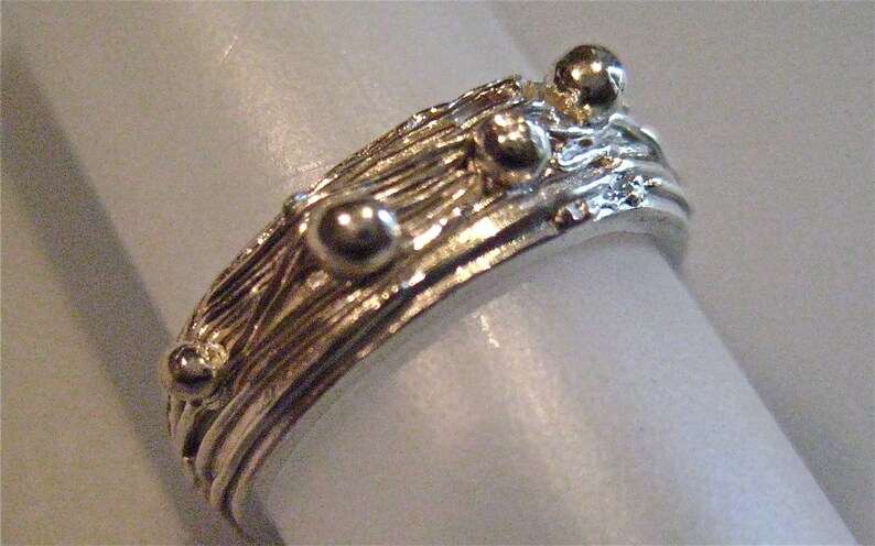 Fine Silver nesting ring with little dots of silver