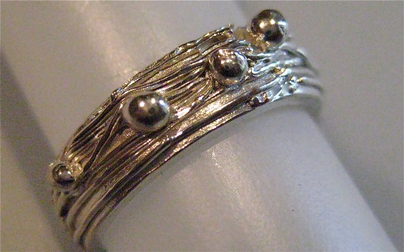 Fine Silver nesting ring with little dots of silver