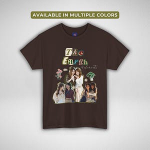 May include: A brown t-shirt with the text "The Earth 4 elements" in a colourful font. The shirt features a collage of images of people and floral graphics. The top of the shirt reads "AVAILABLE IN MULTIPLE COLOURS".