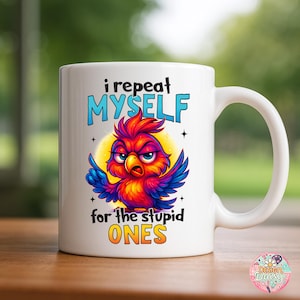 May include: White ceramic mug with a colorful cartoon bird illustration. The bird is red, orange, blue, and purple with an angry expression. Text on the mug reads "i repeat MYSELF for the stupid ONES."