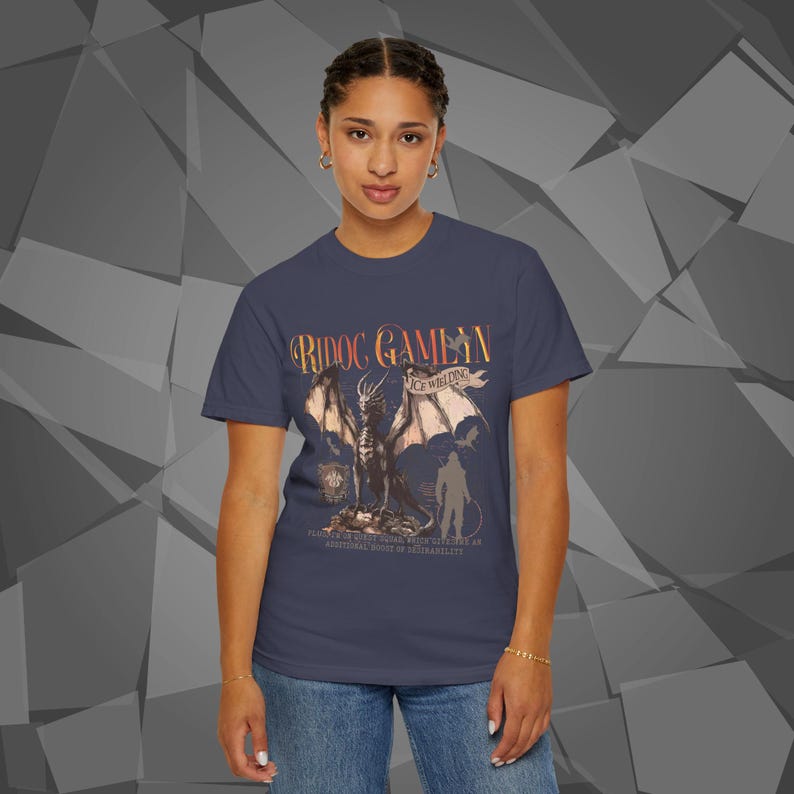 Comfort Colors unisex T-shirt featuring a Fourth Wing fantasy design inspired by the Empyrean Series. Premium quality 100% cotton shirt with a soft, relaxed fit, available in 14 colors and plus sizes. Bookish fantasy apparel inspired by Iron Flame, Onyx Storm, Basgiath War College, Dragon Riders, Fly or Die, and the Riders Quadrant, for fans of Violet Sorrengail, Xaden Riorson, and Rebecca Yarros.