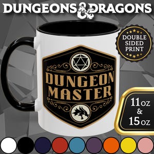 May include: White ceramic mug with a black handle and interior. The mug features a black and gold design with the words "DUNGEON MASTER" and a Dungeons & Dragons logo. The mug is available in 11 oz and 15 oz sizes.