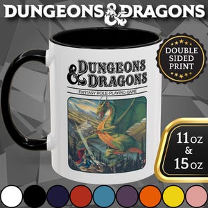 May include: White ceramic mug with a black handle and interior, featuring the "Dungeons & Dragons" logo and a fantasy scene with a dragon. The mug has a double-sided print and is available in 11 oz and 15 oz sizes.