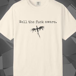 Comfort Colors unisex T-shirt featuring a Fourth Wing fantasy design inspired by the Empyrean Series. Premium quality 100% cotton shirt with a soft, relaxed fit, available in 14 colors and plus sizes. Bookish fantasy apparel inspired by Iron Flame, Onyx Storm, Basgiath War College, Dragon Riders, Fly or Die, and the Riders Quadrant, for fans of Violet Sorrengail, Xaden Riorson, and Rebecca Yarros.