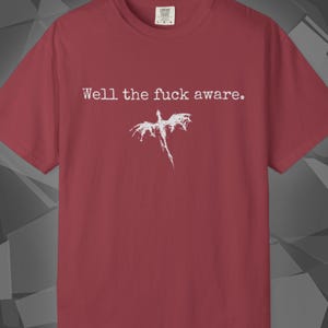 Comfort Colors unisex T-shirt featuring a Fourth Wing fantasy design inspired by the Empyrean Series. Premium quality 100% cotton shirt with a soft, relaxed fit, available in 14 colors and plus sizes. Bookish fantasy apparel inspired by Iron Flame, Onyx Storm, Basgiath War College, Dragon Riders, Fly or Die, and the Riders Quadrant, for fans of Violet Sorrengail, Xaden Riorson, and Rebecca Yarros.