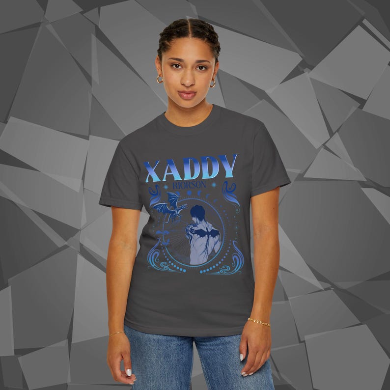 Comfort Colors unisex T-shirt featuring a Fourth Wing fantasy design inspired by the Empyrean Series. Premium quality 100% cotton shirt with a soft, relaxed fit, available in 3 colors and plus sizes. Bookish fantasy apparel inspired by Iron Flame, Onyx Storm, Basgiath War College, Dragon Riders, Fly or Die, and the Riders Quadrant, for fans of Violet Sorrengail, Xaden Riorson, and Rebecca Yarros.