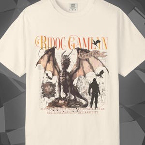Comfort Colors unisex T-shirt featuring a Fourth Wing fantasy design inspired by the Empyrean Series. Premium quality 100% cotton shirt with a soft, relaxed fit, available in 14 colors and plus sizes. Bookish fantasy apparel inspired by Iron Flame, Onyx Storm, Basgiath War College, Dragon Riders, Fly or Die, and the Riders Quadrant, for fans of Violet Sorrengail, Xaden Riorson, and Rebecca Yarros.