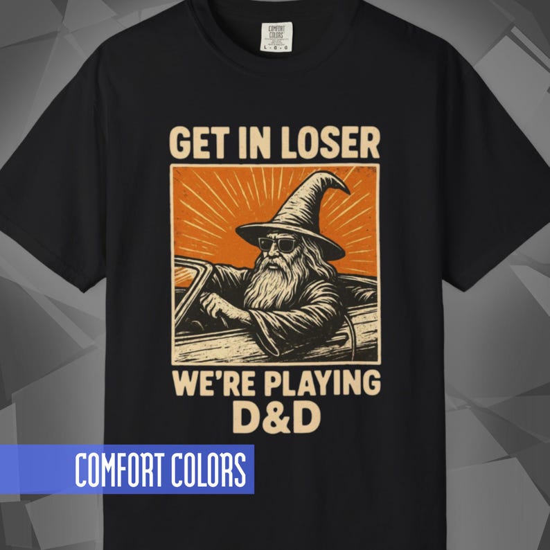 Comfort Colors T-shirt with a D&D funny meme/Dungeons & Dragons graphic. The shirt is 100% cotton, premium quality, available in 14 colors, unisex fit, plus size options. RPG tabletop role play gamer apparel. T-shirt featuring a wizard in a car and the text "Get In Loser We're Playing D&D".