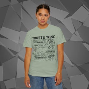 Comfort Colors unisex T-shirt featuring a Fourth Wing fantasy design inspired by the Empyrean Series. Premium quality 100% cotton shirt with a soft, relaxed fit, available in 13 colors and plus sizes. Bookish fantasy apparel inspired by Iron Flame, Onyx Storm, Basgiath War College, Dragon Riders, Fly or Die, and the Riders Quadrant, for fans of Violet Sorrengail, Xaden Riorson, and Rebecca Yarros.