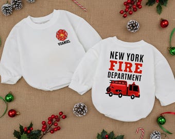 May include: Two white sweatshirts with long sleeves. One has a red and gold firefighter emblem with "VDANIEL" below. The other displays "NEW YORK FIRE DEPARTMENT" in red and black text, with a red fire engine graphic.