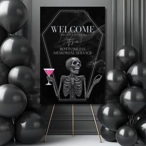 May include: A black sign on a gold easel with the words "WELCOME THIS ISN'T A FUNERAL it's a BOTTOMLESS MEMORIAL SERVICE". The sign features a skeleton holding a pink cocktail and a cloud of smoke.
