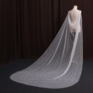 TV17/ Pearl wedding cape. Sheer tulle bridal cape adorned with pearls. Ivory bridal cape made of sparkling tulle. custom bridal cape