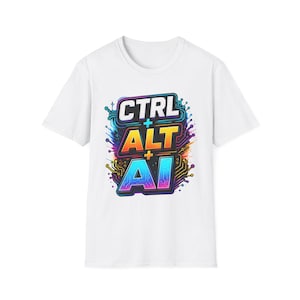 Peut inclure: Un t-shirt blanc à manches courtes arborant un motif central avec le texte CTRL + ALT + AI. Les lettres sont stylisées avec un dégradé multicolore vibrant et entourées de motifs et de lignes de circuits imprimés colorés et complexes.