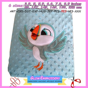 May include: A blue and white embroidered applique design of a cartoon puffin with orange beak and blue eyes. The design is on a light blue fabric with a textured surface. The text "GLOW EMBROIDERY" and "EMBROIDERY MACHINE APPLIQUE DESIGNS" is at the bottom of the image. The image also includes text listing 6 sizes in inches and millimeters.