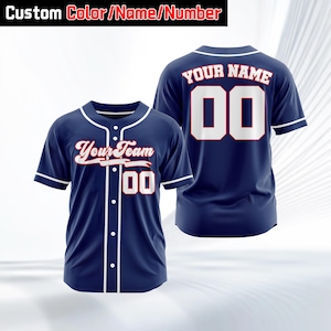 May include: Navy blue baseball jersey with white trim and buttons. The front displays "Your Team" in script and the number "00". The back shows "Your Name" and the number "00". The top banner reads "Custom Color/Name/Number".