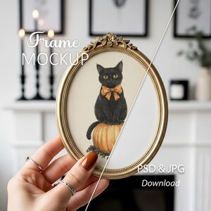 May include: An oval, gold-colored frame with a floral design at the top, holding a picture of a black cat with an orange bow tie sitting on a pumpkin. The image has the text "Frame MOCKUP" and "PSD & JPG Download".