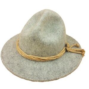 May include: A gray fedora-style hat with a wide brim and a light brown rope band. The hat has a slightly distressed look, with a soft, felt-like texture. The rope band is tied on the side.