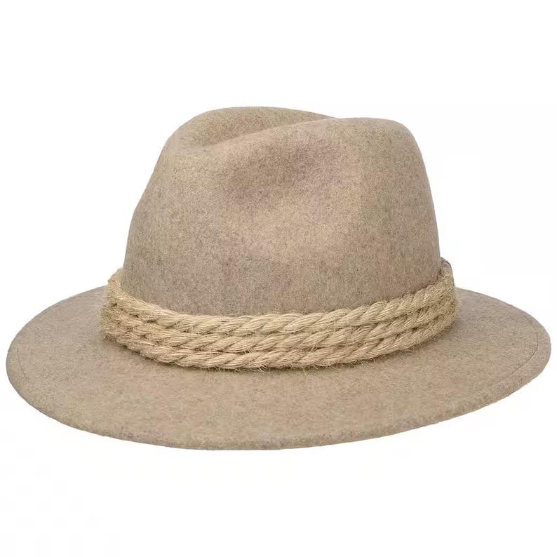 May include: A tan fedora-style hat with a wide brim and a rope band. The hat is made of a soft material and has a classic, timeless design. The hat's brim measures approximately 3 inches wide.