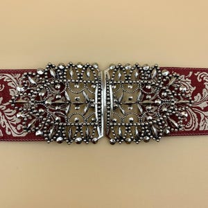 This is an antique silver traditional brass buckle that is handmade in Bavaria and is perfect for sewing on.