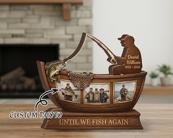 May include: Wooden fishing-themed photo display. The display features a boat shape with a fisherman silhouette, a fish, and space for three photos. Text includes "Custom Photo" and "Until We Fish Again."