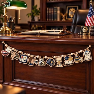 May include: A wooden garland featuring speech therapy themed icons including a mouth, ear, communication board, speaking child, ABC blocks, brain, hourglass, open book with speech bubbles, stacking rings, and a clipboard labelled SLP.