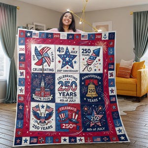 May include: A patriotic quilt featuring a red, white, and blue design celebrating the 250th anniversary of the 4th of July. The quilt includes images of a pinwheel, star, rocket, fireworks, and the Liberty Bell. The text reads "Celebrating 250 Years."