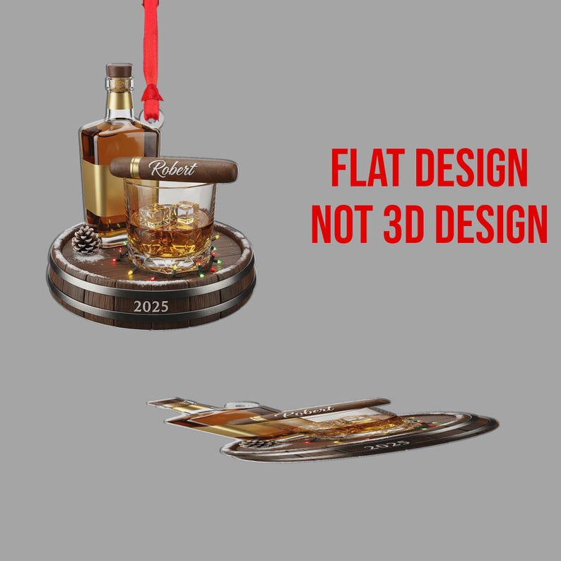 May include: A whiskey-themed ornament with a bottle, a glass of whiskey with ice, and a cigar labeled "Robert." The ornament is on a wooden barrel base with the year "2025." A red ribbon hangs from the top. The text "FLAT DESIGN NOT 3D DESIGN" is visible.