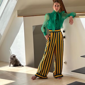 The orange and green striped pants