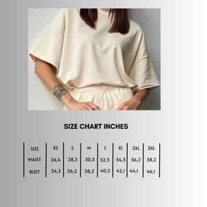 May include: Size chart in inches for a garment with measurements for waist and bust in sizes XS, S, M, L, XL, 2XL, and 3XL.