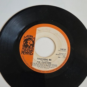 7-inch 45 RPM vinylTouching Me&quot; by The Ovations.