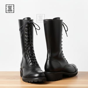 May include: Black leather knee-high boots with lace-up fastening and brogue detailing. The boots feature a chunky sole and a small heel. The brand logo "CRAFT EDGE GOODS" is visible. The boots are approximately 40 cm high.