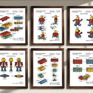May include: A set of six framed United States Patent prints featuring technical illustrations of toy building bricks, figures, and elements. Each white document displays detailed diagrams, numbered figures, and patent text in black ink with colored accents.