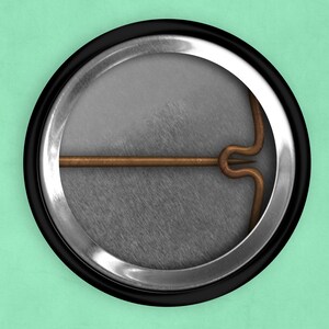 May include: The back of a round button with a silver metal rim and a black plastic backing. A copper-colored pin is attached to the back of the button.
