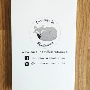 May include: A white card with a black and white illustration of a sleeping fox in a circle with the text "Caroline Wu Illustration" and the website address "www.carolinewillustration.ca". Social media icons for Facebook and Instagram are included with the text "Caroline W Illustration" and "@carolinew_illustration".