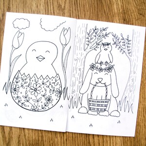 May include: A black and white coloring page featuring a chick hatching from an egg decorated with flowers and a bunny wearing a flower crown and holding a basket.