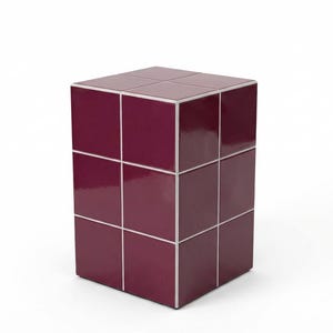 May include: A contemporary side table in a cube shape. It's made from glossy, deep burgundy tiles with white grout. The geometric design is simple and modern, suitable for a range of interior styles.
