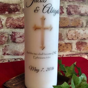 May include: White wedding candle with a gold cross and the names Jacob & Abigail, the text "And the two shall become ONE Ephesians 5:31" and the date May 7, 2016.