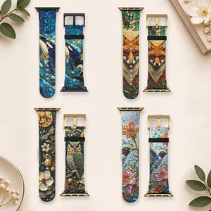 May include: Four silicone watch bands featuring vibrant, detailed prints: one with an orca in blue water, one with a fox face, one with an owl among flowers, and one with hummingbirds and flowers. Each band includes a buckle and connector.