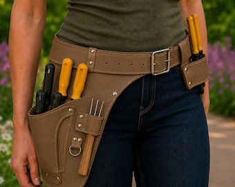 May include: A brown utility belt featuring multiple pockets and loops, secured with a metal buckle. The belt holds several tools with yellow and black handles, including screwdrivers and a small metal fork, all organised in reinforced leather-like pouches.