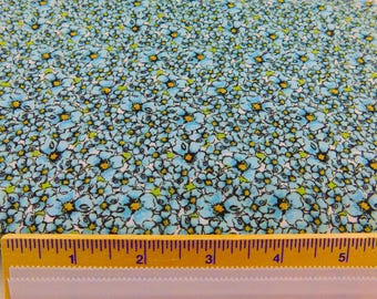 Blue Floral Fabric outlined in black with Yellow Centers on a White Background by Pamela Mostek for Marcus Brothers Textiles - BTY