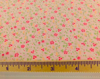 Light Peach Fabric with Orange and Pale Yellow Flowers and Green Leaves by Jo-Ann Fabrics - BTY