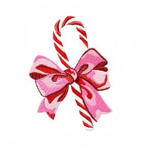 May include: A candy cane, featuring red and white stripes, is embellished with a pink bow with red detailing. The bow's design is detailed, enhancing the traditional candy cane form. The image is set against a plain white backdrop.