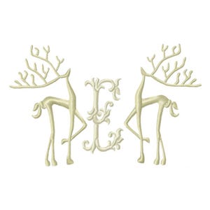 May include: An embroidered design featuring two stylized deer flanking the letter "E". The deer are depicted in a graceful pose with intricate antlers. The letter "E" has a decorative, floral design. The color is a light beige.