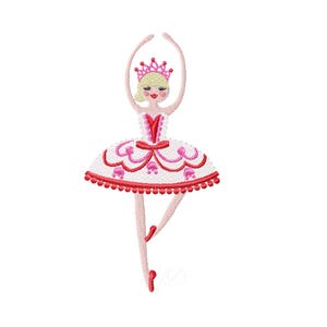 May include: Embroidered design of a ballerina in a white tutu with red trim and accents. The ballerina has blonde hair, a pink crown, and is in a ballet pose with arms raised. The design is on a white background.