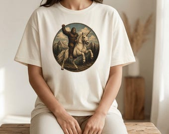 Bigfoot Riding Unicorn Shirt, Vintage Sasquatch Tee, Funny Cryptid Shirt, Comfort Colors Graphic Tee, Fantasy Bigfoot Gift