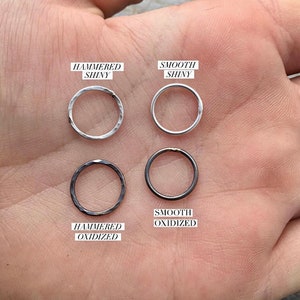 May include: Four metal rings in different finishes: hammered shiny, smooth shiny, hammered oxidized, and smooth oxidized.
