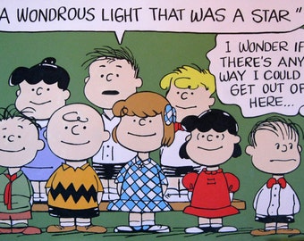 May include: A Peanuts comic strip illustration featuring a group of children, including Charlie Brown, Lucy, Linus, and Sally. The children are standing in a line, and the speech bubble above them reads "A wondrous light that was a star".  Charlie Brown is wearing a green shirt and a red scarf. Lucy is wearing a red dress. Linus is wearing a blue shirt and a yellow scarf. Sally is wearing a blue and white dress. The speech bubble above Sally reads "I wonder if there's any way I could get out of here..."