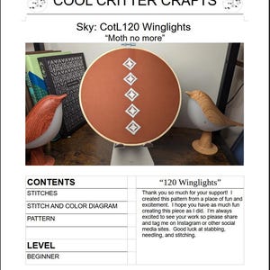 May include: An embroidery hoop with a rust-colored fabric featuring a white diamond pattern. The text "COOL CRITTER CRAFTS" and "Sky: CotL120 Winglights" are at the top. The text "Moth no more" is also visible.