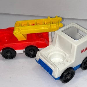 May include: Two vintage Little People toy vehicles. A red fire truck with a yellow ladder and a white mail truck with blue accents. Both trucks have black wheels and a round hole on top.